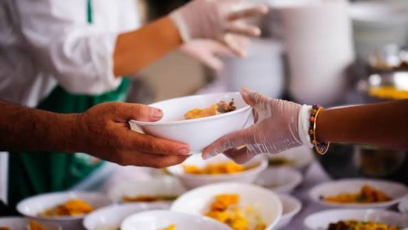 A photo of a food being handed out